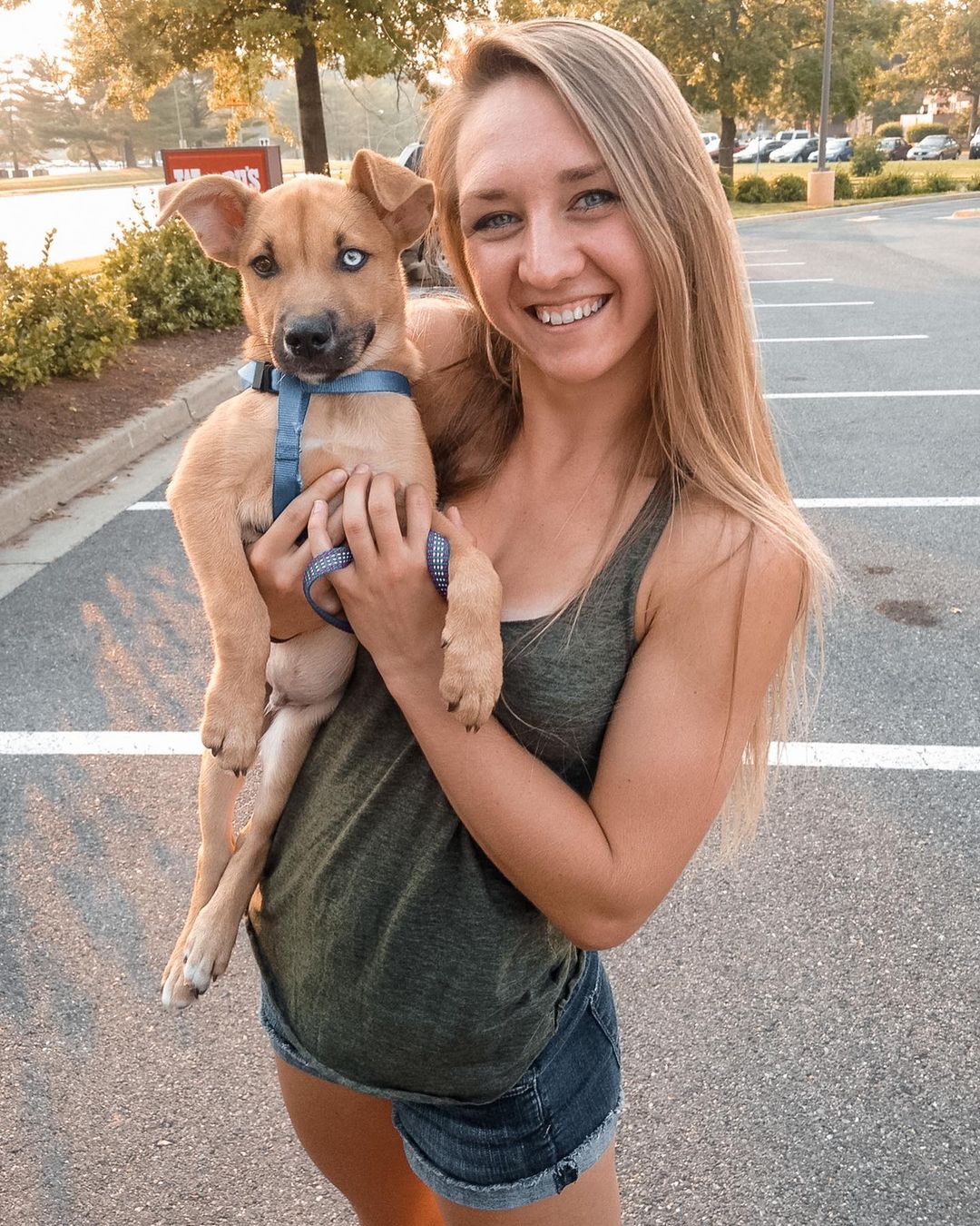 woman holding puppy