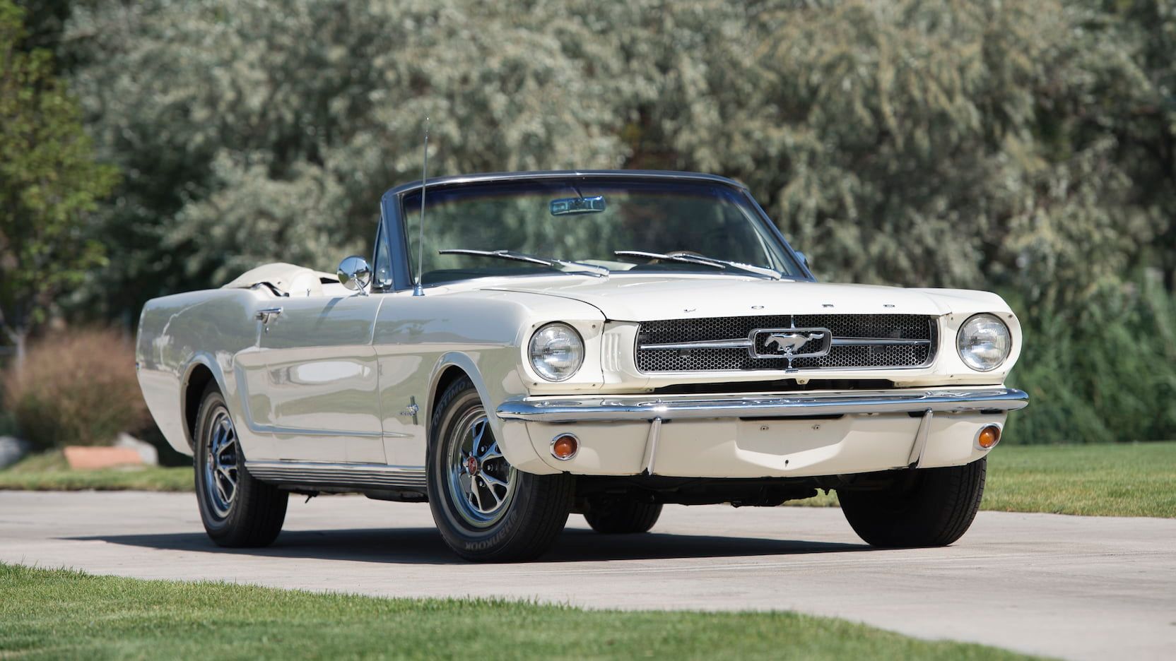 A parked 1965 Ford Mustang convertible