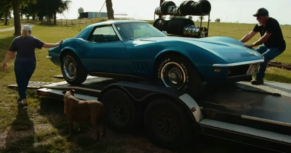 Vickie Cheney (left) and Darron Cheney offloading a 1968 Chevrolet Corvette