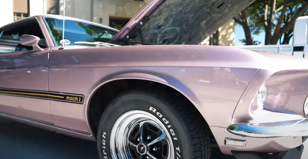 A 1969 Ford Mustang Mach 1 in Lilac Frost Metallic, front