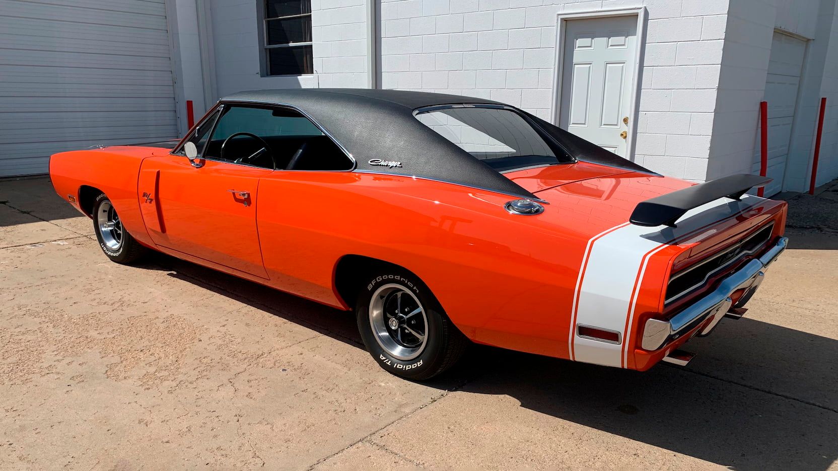 A parked orange 1970 Dodge Charger R/T