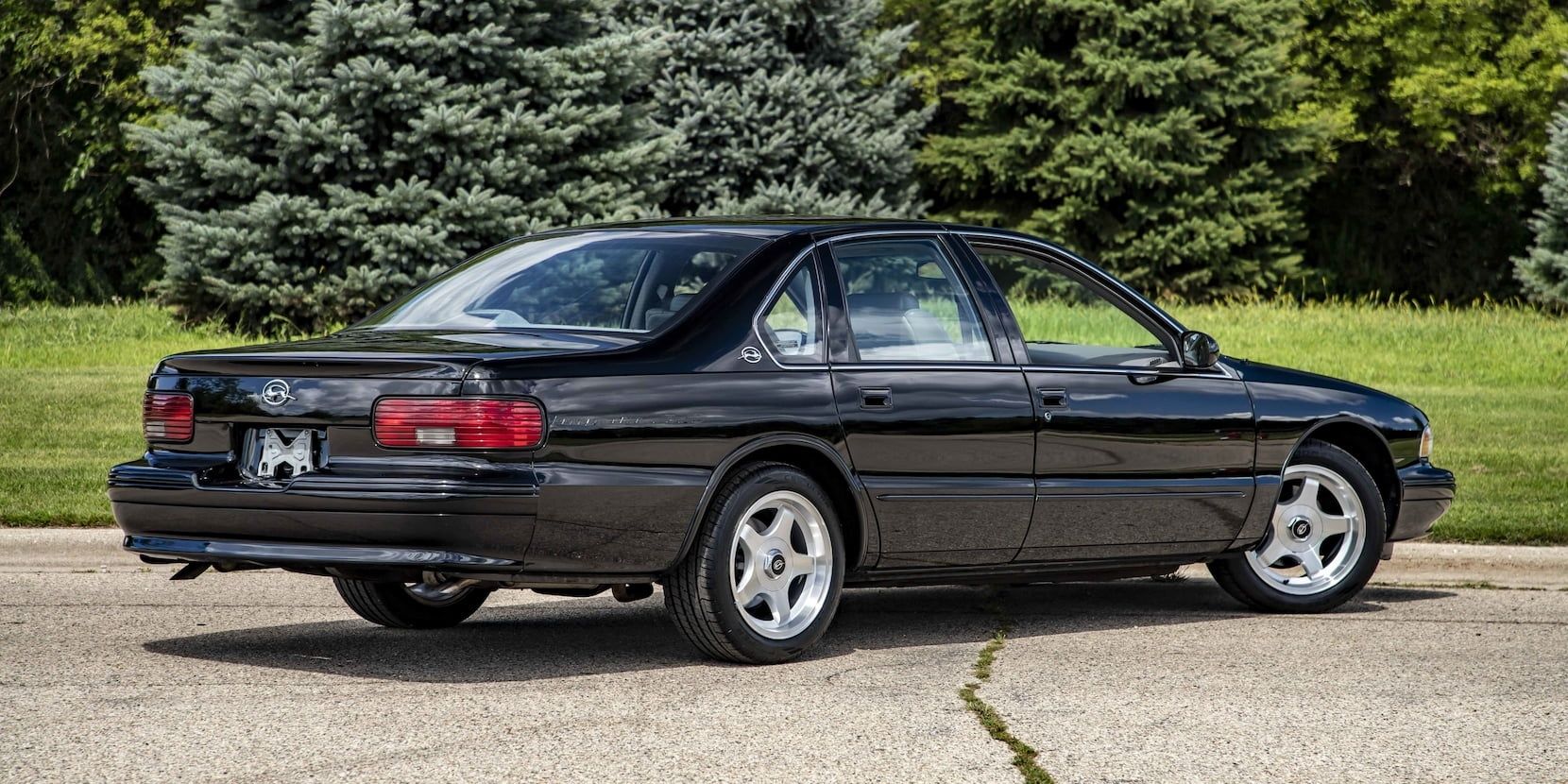 Black 1996 Chevrolet Impala SS on the driveway