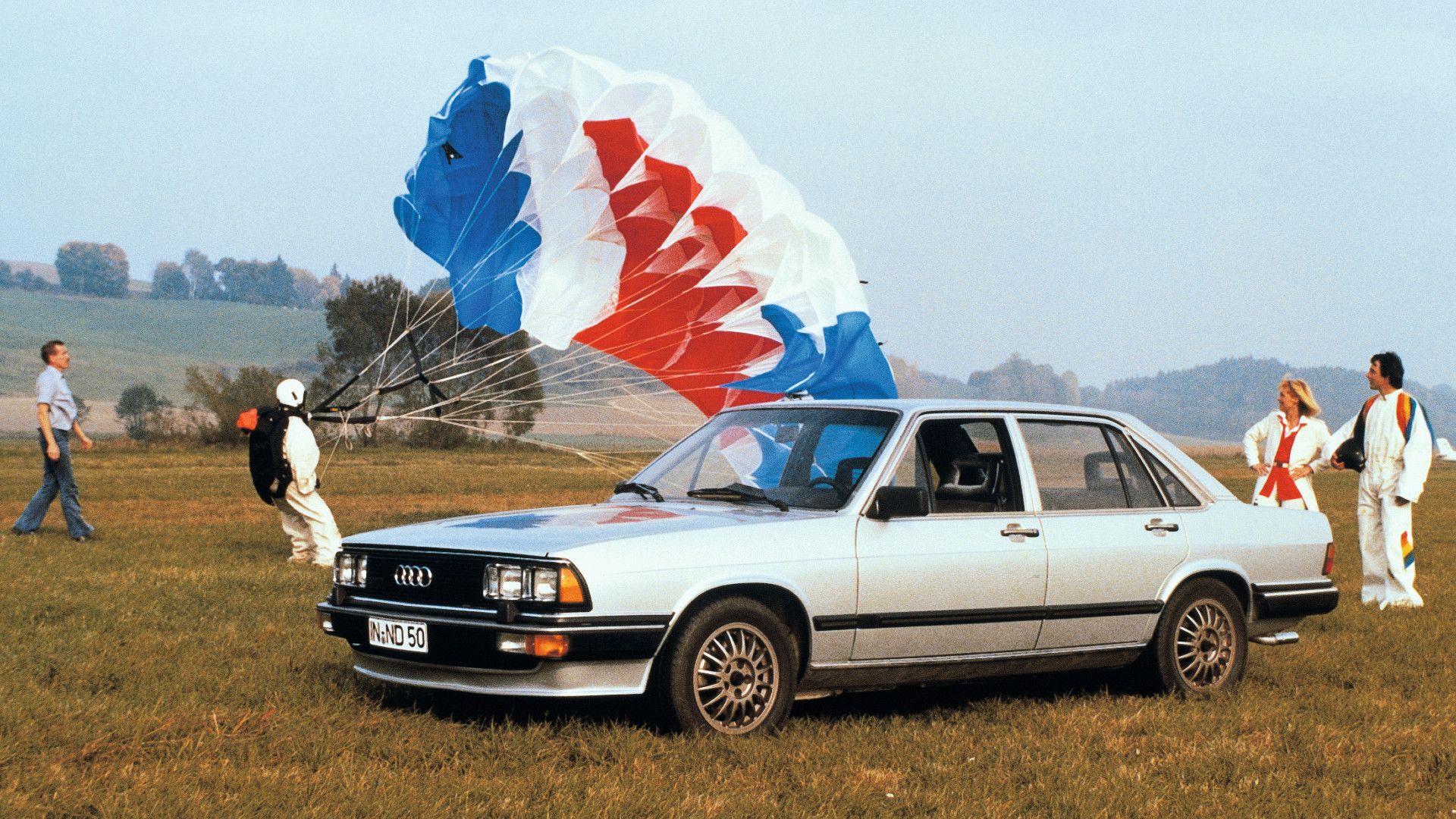 Audi 200 Turbo with a skydiver and spectators