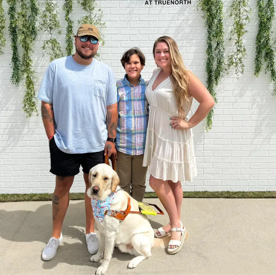 family and cute white dog