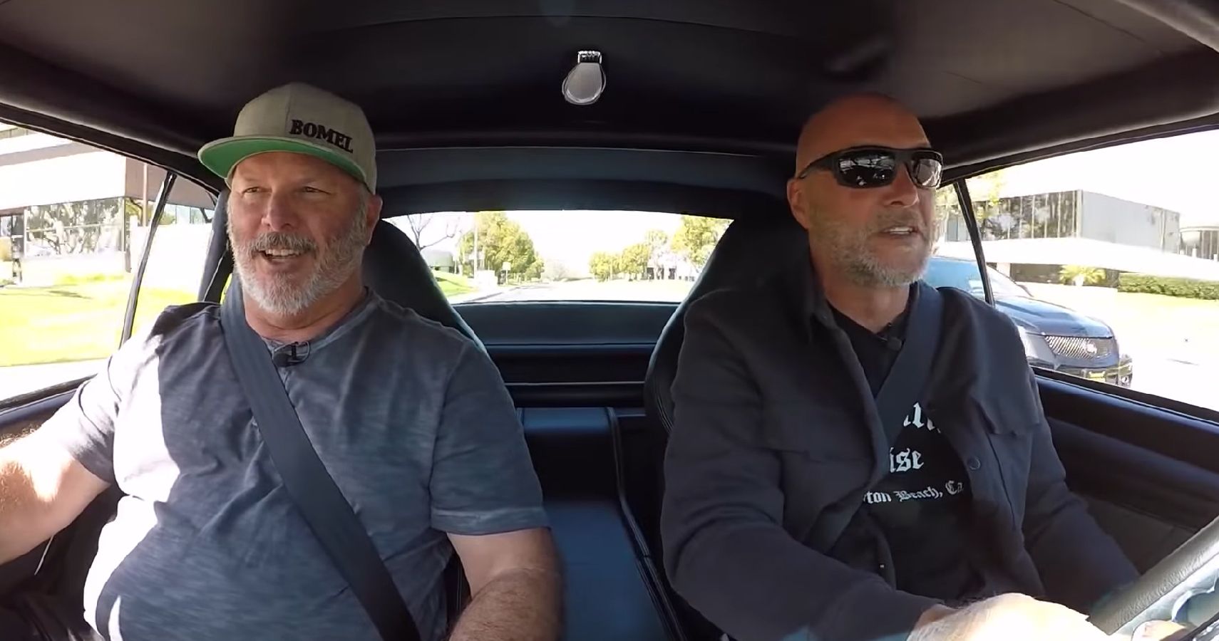 Chevy Chevelle interior, two men in front of car driving