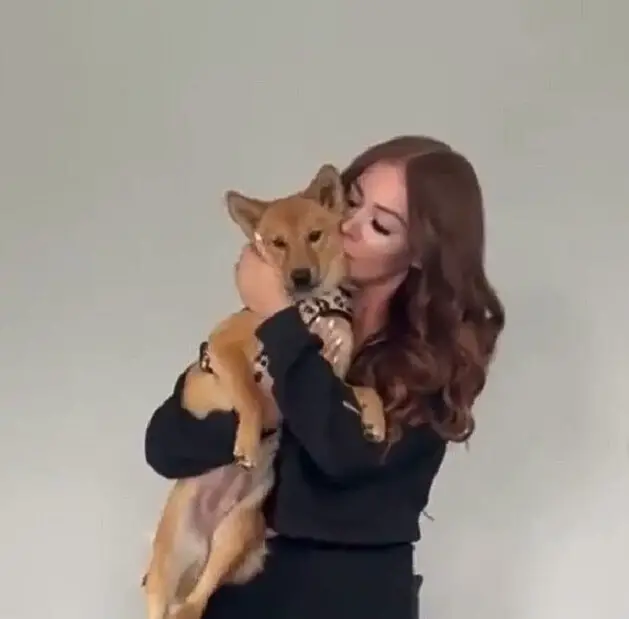 woman holding rosie the dog