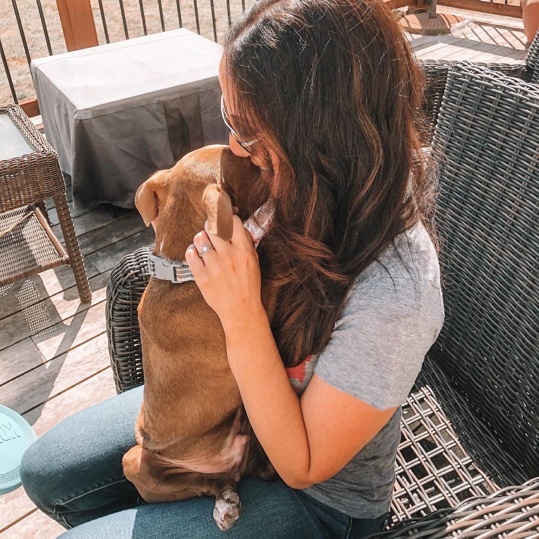 woman with dog in her lap